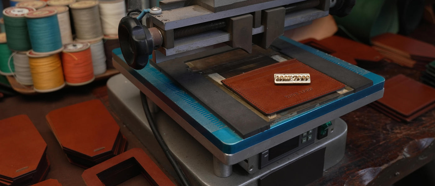 Beron Leather Goods private label service: A premium burgundy croc-embossed leather iPhone case with custom gold logo stamping. Specialized small batch manufacturing for boutique brands