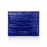 Blue crocodile-patterned cardholder with 'HIRAM BERON' branding on a white background