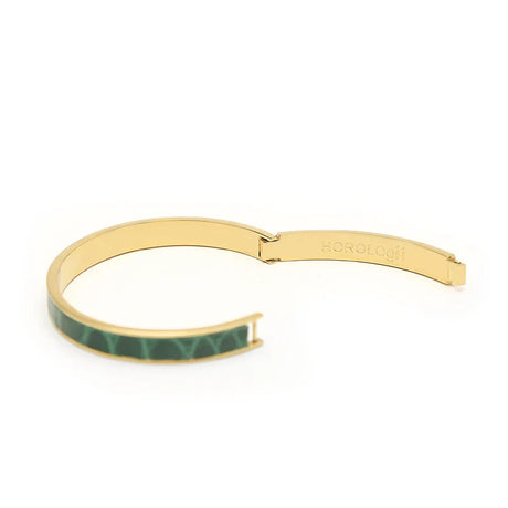 Gold bangle with green geometric pattern, sleek modern design for luxury accessories
