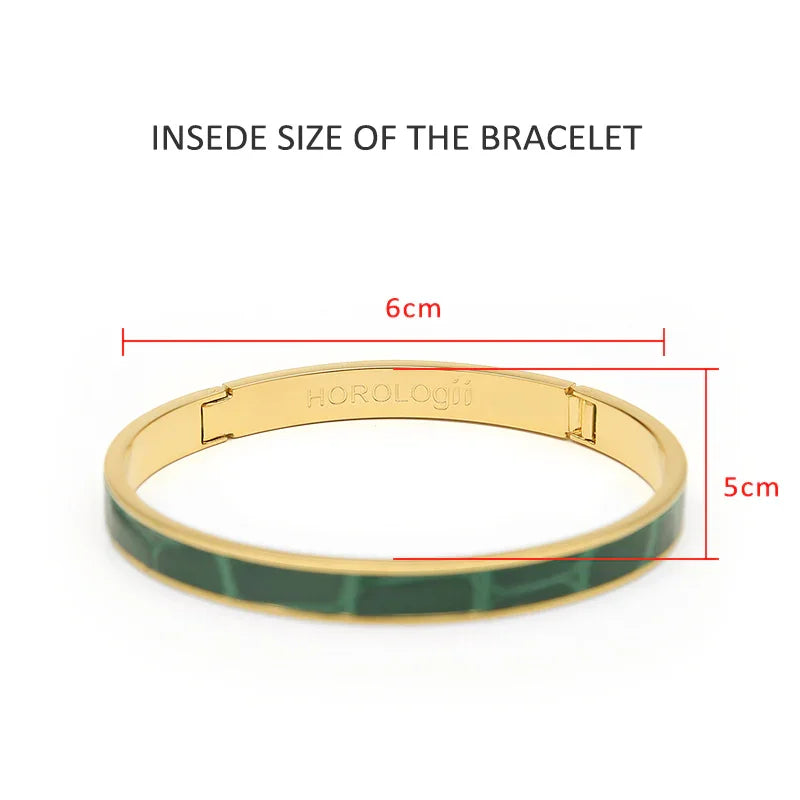 Gold bangle with green croc-embossed band, 6cm x 5cm interior, luxury women's bracelet