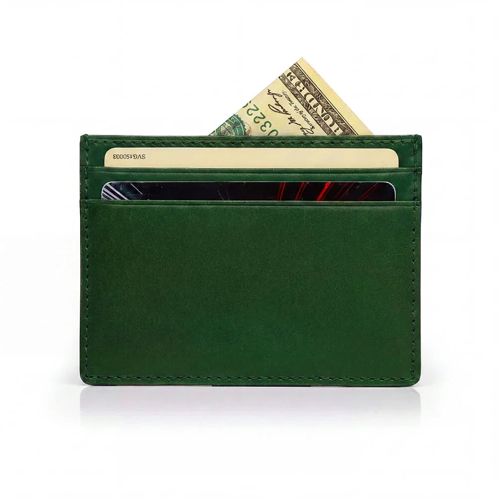 Green leather wallet with cards and money on a white background