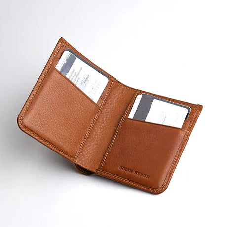 Brown leather wallet with card slots on a white background