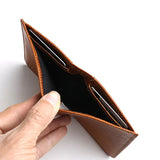 close-up of the hidden pocket for the brown wallet