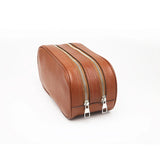 Close-up of the side of brown toiletry bag