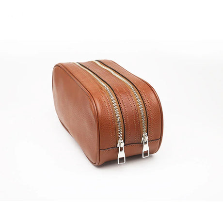 Close-up of the side of brown toiletry bag